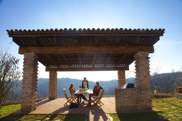 Portico with new roof for shady dinning at long stone table